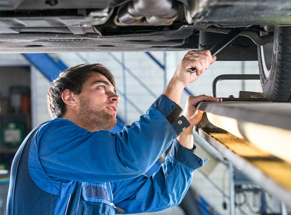 Mechanic checking under a vehicle - Car Repairs Bilston